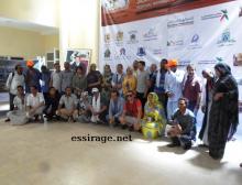 جانب من صورة جماعية تم التقاطها عند انتهاء إحدى فعاليات المهرجان الطي يشغل الأيام من 02 - 06 مايو 2015 بمدينة آسا بالجنوب المغربي (السراج)